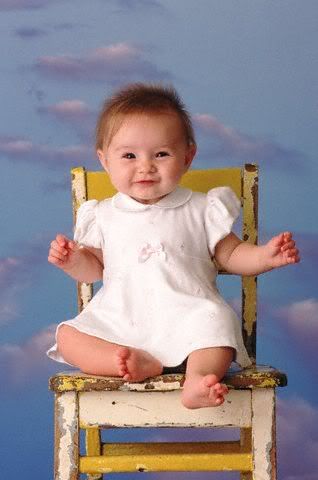 Cute girl seating on chair